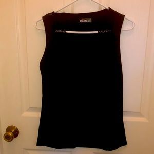 Woman’s black camisole with lace trim around the neck.